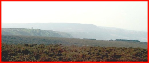 A view along White Edge - Note the two walkers to the left of the photograph .